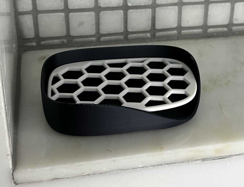 stylish hexagon soap dish doubles as sponge holder in white and black
