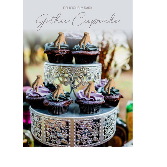 gothic cupcakes with thing hand cupcake topper on each
