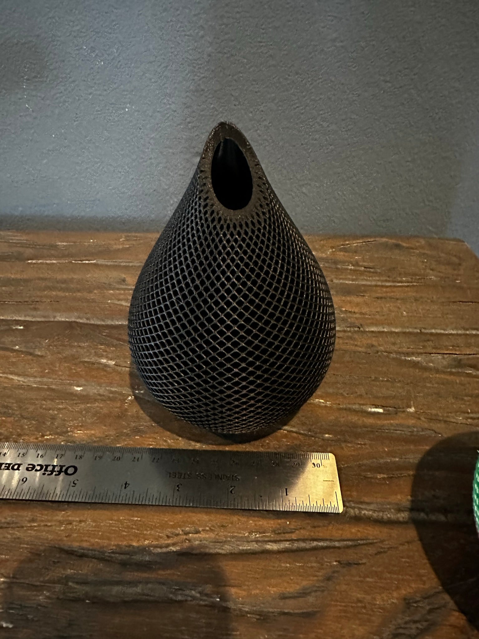 Photo of Handmade 3D Printed Vase in Black Color with Mesh Pattern showing its measurements of approximately 4 inches wide