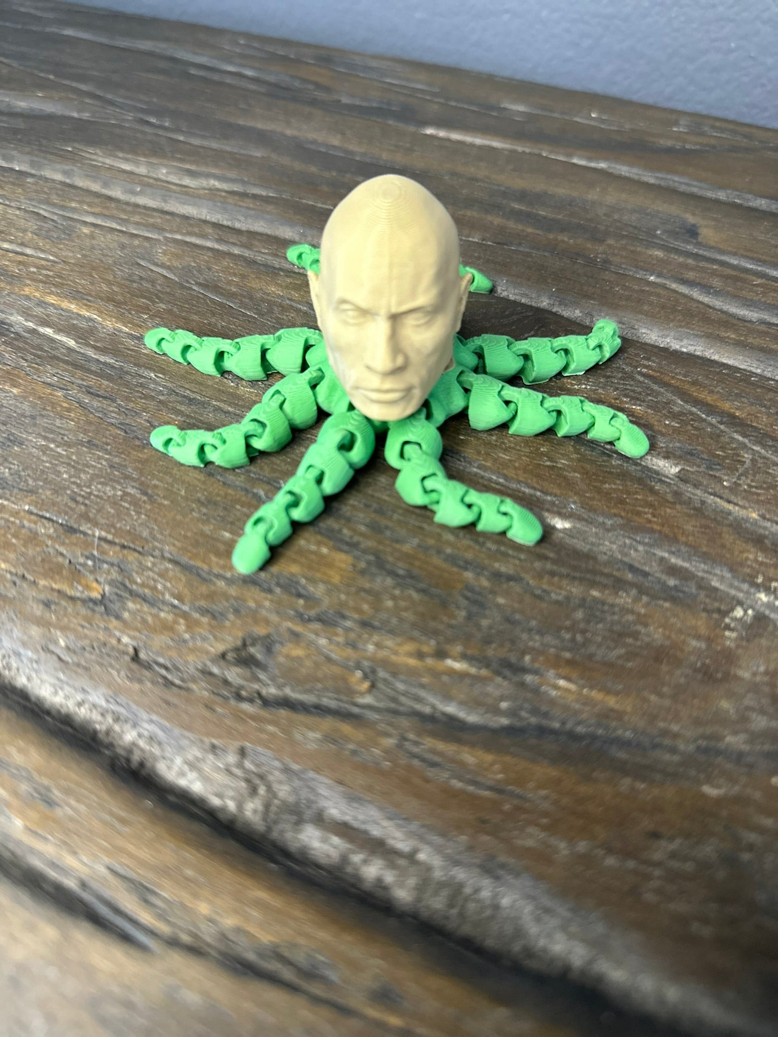 ROCK-topus Articulated Desk Toy with a green body and beige head