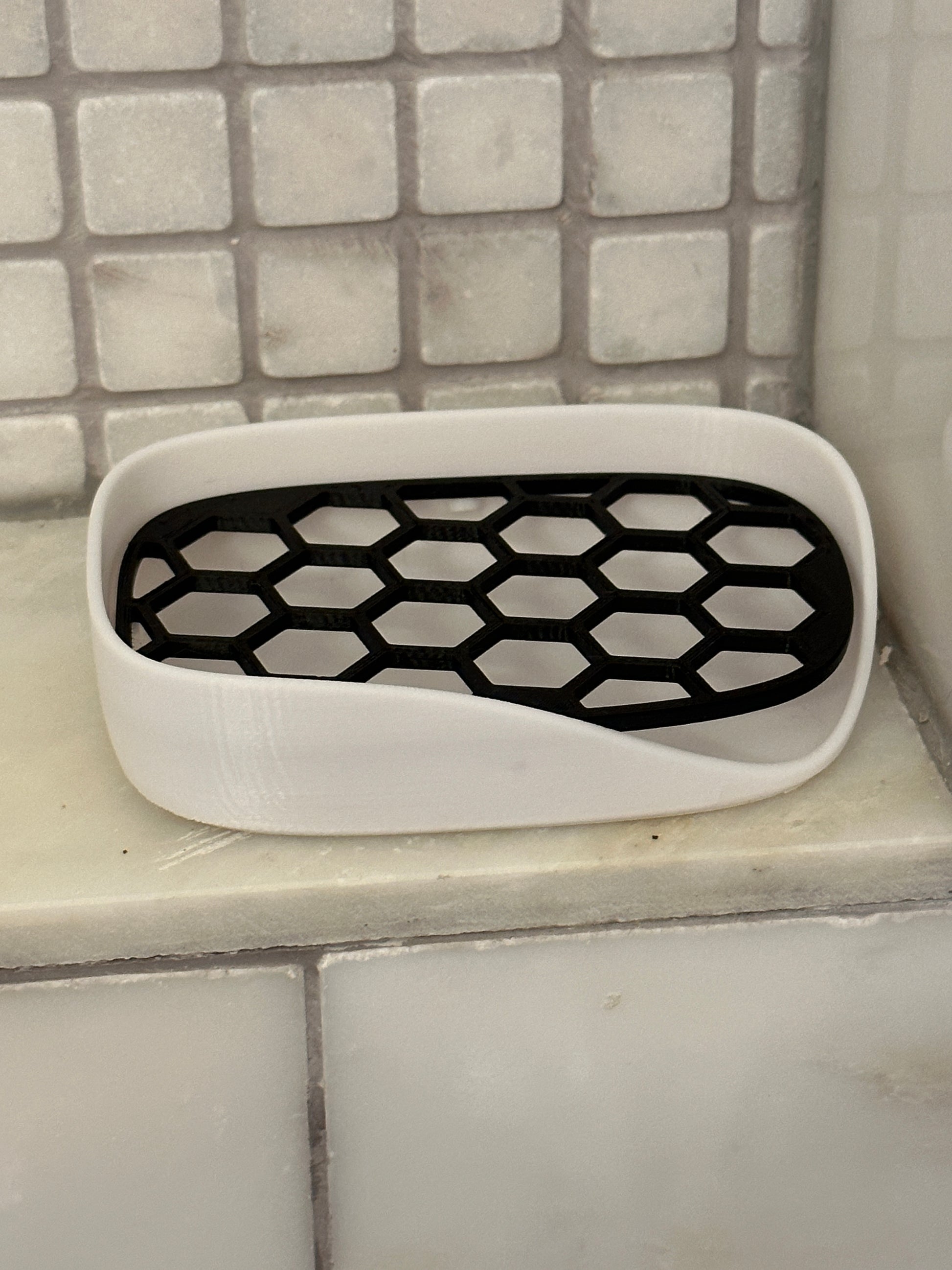 geometric hexagon style dish with white base and black removable tray