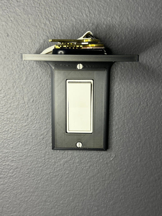 Close-up view of the wall plate with built-in shelf, showcasing the GFCI Vertical Light Switch Plate design