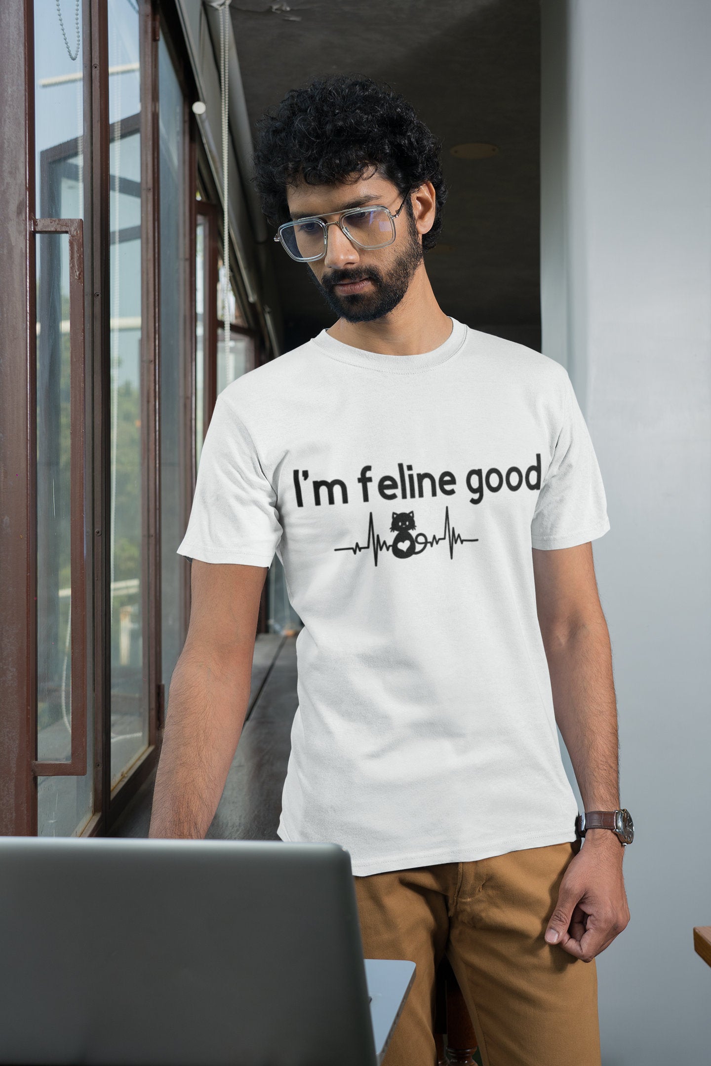 guy wearing the I'm feline good shirt