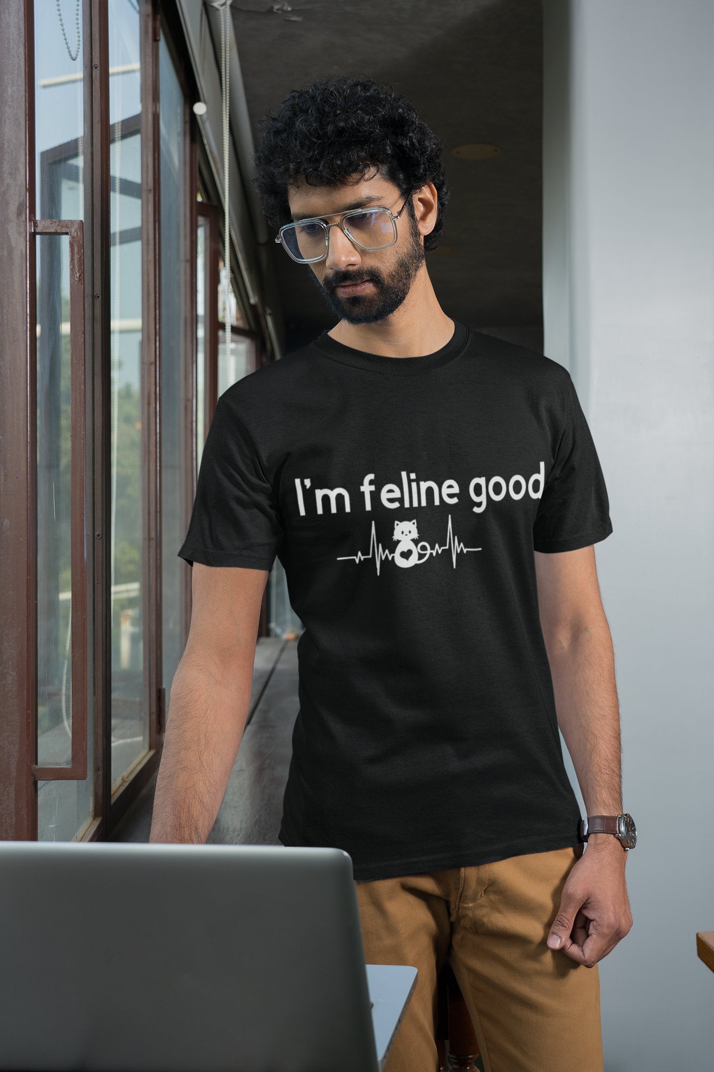 black version of the I'm Feline Good shirt